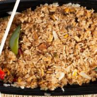 Spicy Fried Rice · Fried brown rice with bell peppers, fresh chili, basil, onions and eggs.