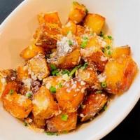 Roasted Potatoes · Roasted in duck fat, crispy outside and soft and creamy inside, finished with parmesan and c...
