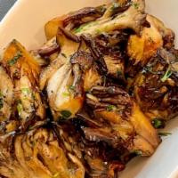 Hen Of The Woods · These hearty mushrooms foraged from the base of oak trees in the northwest are sautéed with ...