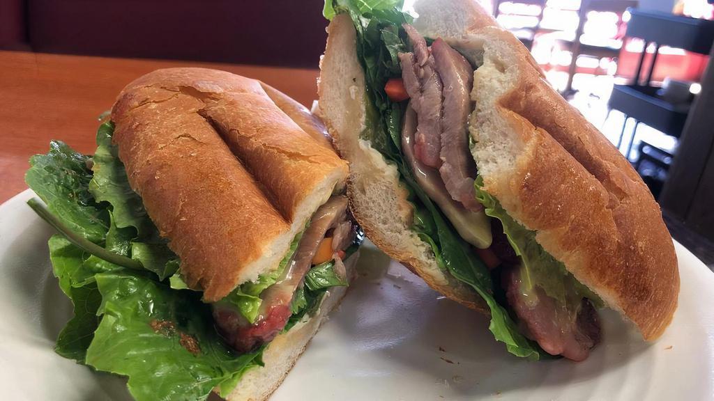 Banh-Mi · Vietnamese sandwich, French bread baguette with chicken, Vietnamese ham, Lettuce romaine, spicy Mayo, cilantro, pickled carrot and radish. Come with French fried