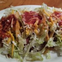 Ground Beef Tacos (2) · With rice and beans.
