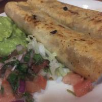 Ground Beef Taquitos (2) · With rice and beans and guacamole.