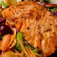 Seared Salmon Salad · Seared fresh salmon, mixed green salad, tomatoes, cabbage. carrots and balsamic dressing.