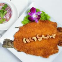 Sunshine Trout · Deep fried crispy boneless trout served with Thai style homemade sauce.