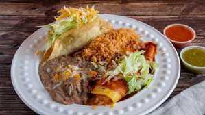 Taco And Enchilada · Shredded beef and Cheese Enchilada Served with rice and beans.