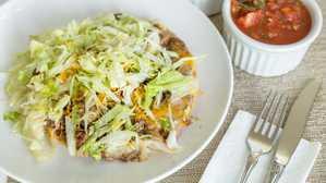 Asada Chimichanga · Meat, beans an cheese burrito fried, guacamole , enchilada sauce,sour cream, lettuce and che...
