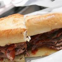 Bbq Tri Tip Sandwich · Signature Smoked Tri Tip topped with Sweet and Sticky BBQ sauce made in house with melted Ch...