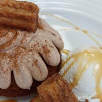 Churro Bundt Cake · Cinnamon Swirl Bundt cake filled with Delicious creamy Dulce de Leche, topped with a Caramel...
