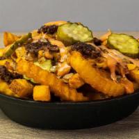 Loaded Truffle Fries · Chopped hamburger, American cheese, caramelized onions, pickles & fried parsley
