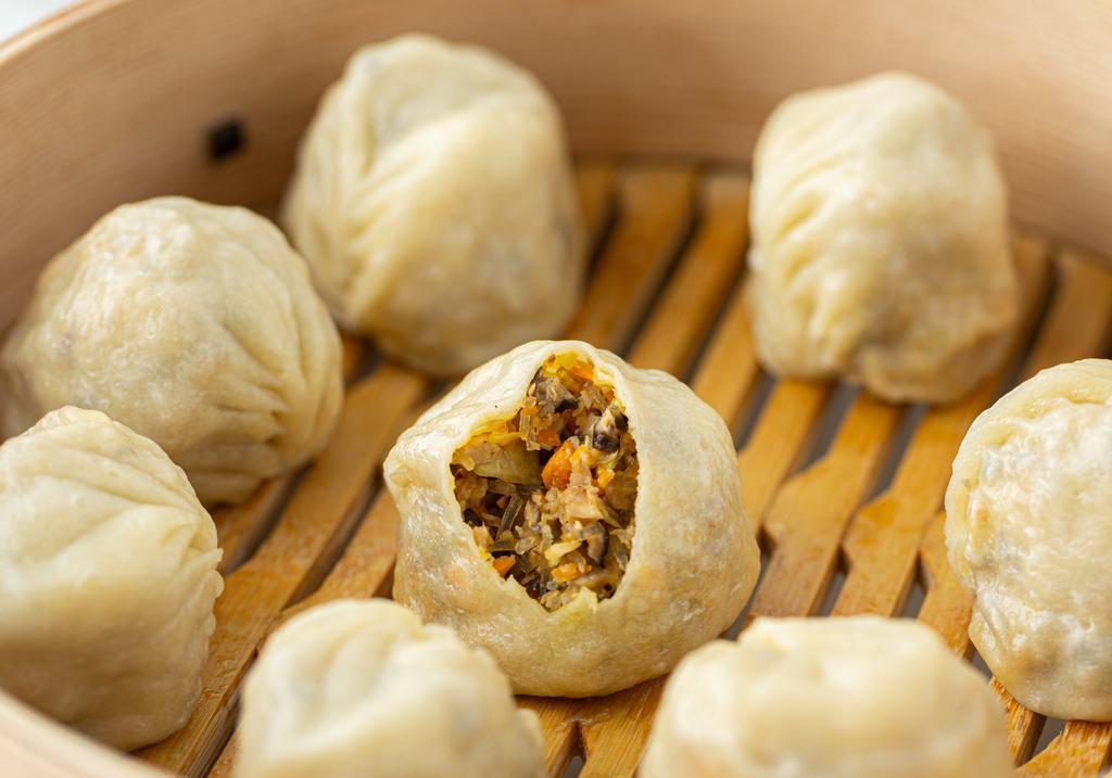 Steamed Vegan · Filled with Shiitake mushrooms, bean curd, cabbage, glass noodle, carrots and shallots.
