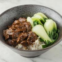 Beef Over Rice (牛肉饭) · Stewed angus beef with baby bok choy, green onion and pickled veggie over steamed white rice
