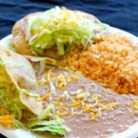 #5 Taco & Enchilada · Shredded beef and cheese enchilada served with rice and beans.