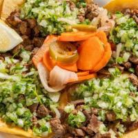 Street Tacos · Four mini tacos with choice of meat. Onions and cilantro.