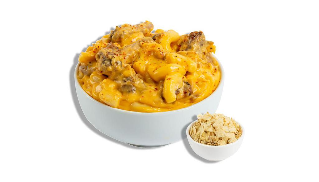 The Slow Cooker · 12 hour braised pork carnitas tossed in our classic cheddar cheese blend, pepper jack cheese, and a dash of chili-lime seasoning. Recommended topper: Sour Cream & Onion Lay's