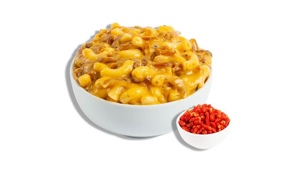 The French Onion · Sweet and savory caramelized onions tossed in our signature sharp cheddar cheese sauce. Recommended topper: Flamin' Hot Cheetos