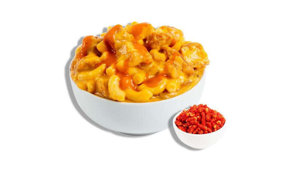 The Buffalo Chicken · All white meat chicken chunks tossed in our signature sharp cheddar cheese blend with a whack of blazin' buffalo hot sauce and pepper jack cheese. Recommended topper: Flamin' Hot Cheetos