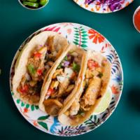 Baja Fish & Shrimp Taco · Fresh fried seasoned fish & shrimp in a flour tortilla topped with fresh shredded cabbage, h...