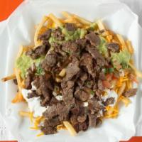 Carne Asada Super Fries · Carne Asada on top of fries with cheese, guacamole, sour cream, and salsa fresca