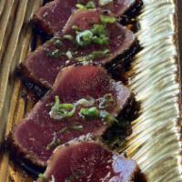Sea Steak · Lightly seared, thin sliced red tuna with scallions, sesame and ponzu.