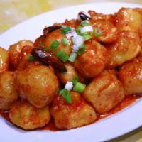 Orange Tofu · Battered deep-fried tofu with special sweet tangy sauce and green onion.