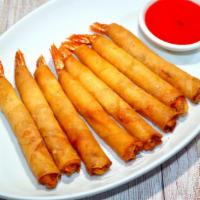 Shrimp Fried Wonton (7Pcs · Shrimp wrapped with egg roll skin, golden deep-fried and served with sweet and sour sauce.