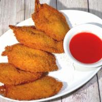 Butterfly Tempura (5 Pcs) · Jumbo battered golden fried shrimp, served with sweet and sour sauce.