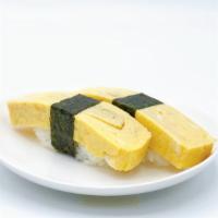 🍣 Tamago Nigiri · 2pc. Homemade sweet egg omelet (Japanese style). *Using free range brown eggs.