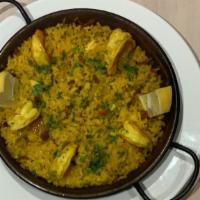 Paella · shrimp, calamari & chorizo with Spanish spiced rice.