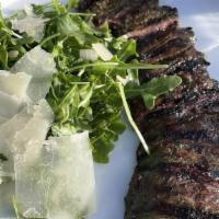 Skirt Steak · herb marinated, arugula salad, lemon vinaigrette, parmesan. GLUTEN FREE