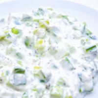 Cucumber Yogurt Salad · Diced cucumbers, mint, yogurt, garlic.