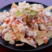 Sushi Nachos · Our nachos come with, homemade tortilla chips, guacamole, salsa, with your choice spicy tuna...