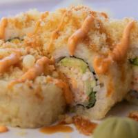 Crunchy Munchy · 8 pieces California roll, and sesame seeds in tempura, topped with crunchies and house sauces.