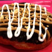 Mud Pie · Large yeast ring dipped in chocolate and Oreo cookie crumbs, drizzled with marshmallow and p...