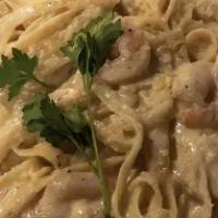 Fettuccine Alfredo  · Small serves two adults and two children large serves four adults.