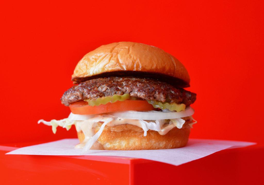 Smash Burger · Juicy, grilled beef burger smashed to perfection with fresh shredded lettuce, sliced tomato, onion, pickles and our famous Smash Sauce on a toasted potato bun