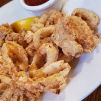 P.B.C. Calamari · Our most popular appetizer. Served with cocktail sauce and fresh lemon.