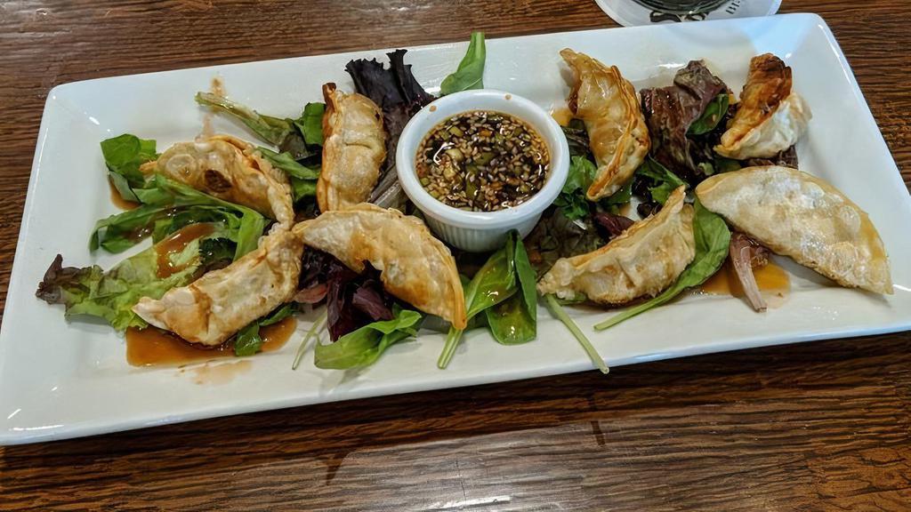 Potstickers · Eight pork and vegetable dumplings fried to a golden brown; with ginger-soy dipping sauce.