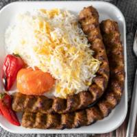 Beef Koobideh · Two skewers of seasoned ground sirlion. Served with basmati rice garnished with saffron and ...