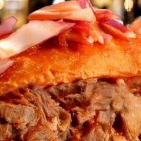 Torta Ahogada · Traditional from Guadalajara special bread pork carnitas spicy chile and tomate salsa onions...
