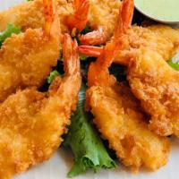 Panko Shrimp · 7 pieces/ Panko fried shrimp, baby greens, cabbage, house made Aji Verde sauce.