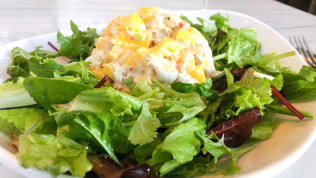 Crab Mango Salad · Gluten Free. Real Lump Crab meat, mango, red pepper, onion, celery, creamy Dijon dressing, on a bed of baby greens with house vinaigrette.