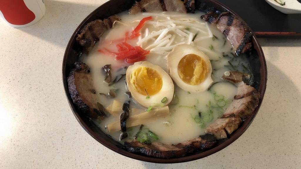 Ramaki Ramen · Pork based broth with more chashu and a full egg. Also has a cloud ear mushroom, bamboo shoot, green onion. red pickled ginger, seaweed flakes, and bean sprouts as toppings.