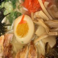 Chicken Ramen · Chicken based broth with chashu and half an egg. Also has cloud ear mushroom, bamboo shoot, ...