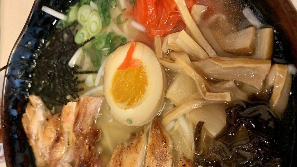 Chicken Ramen · Chicken based broth with chashu and half an egg. Also has cloud ear mushroom, bamboo shoot, green onion. red pickled ginger, seaweed flakes, and bean sprouts as toppings.