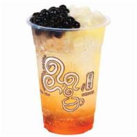 Qq Passionfruit Sparkling · Including 2 toppings: Black pearl and Coconut Jelly