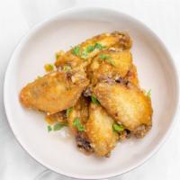 Chicken Wings · (8) Chicken wings in your choice of tamarind or garlic butter sauce.