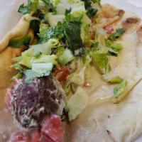 Falafel Wrap · Fresh, crisp falafel with tahini sauce and hummus, diced tomato, lettuce wrapped in pita.