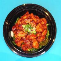 Spicy Chicken (Dak-Galbi) Rice Bowl · Chicken thigh marinated in our house red chili seasoning sauce and fresh romaine