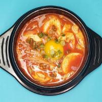 Soft Tofu Soup · Soft bean curd boiled with beef (or seafood) and vegetables. No egg included. 
Served with r...