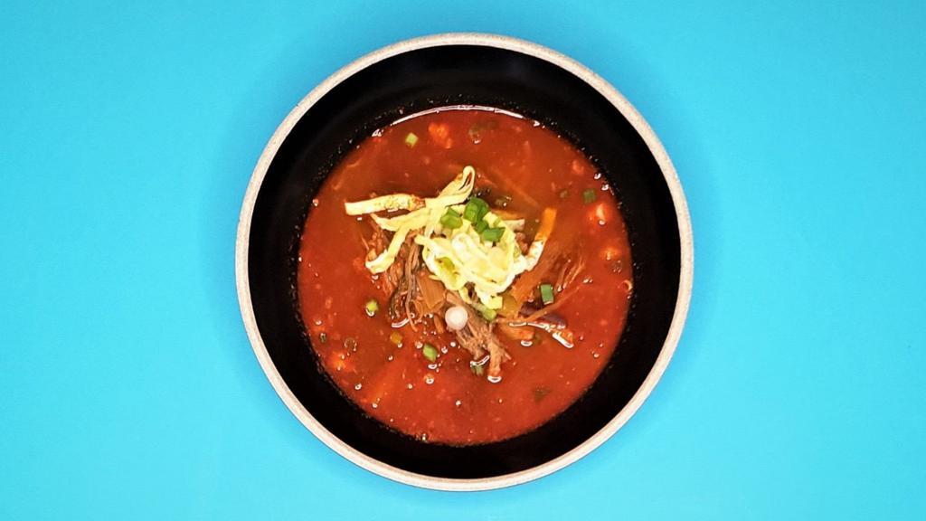 Yukgaejang (Beef & Vegetable Soup) · Spicy (or Mild) soup made with beef, bean sprouts and bracken, green onion. It is widely recognized as an invigorating meal during the summer. Served with rice
and radish kimchi.